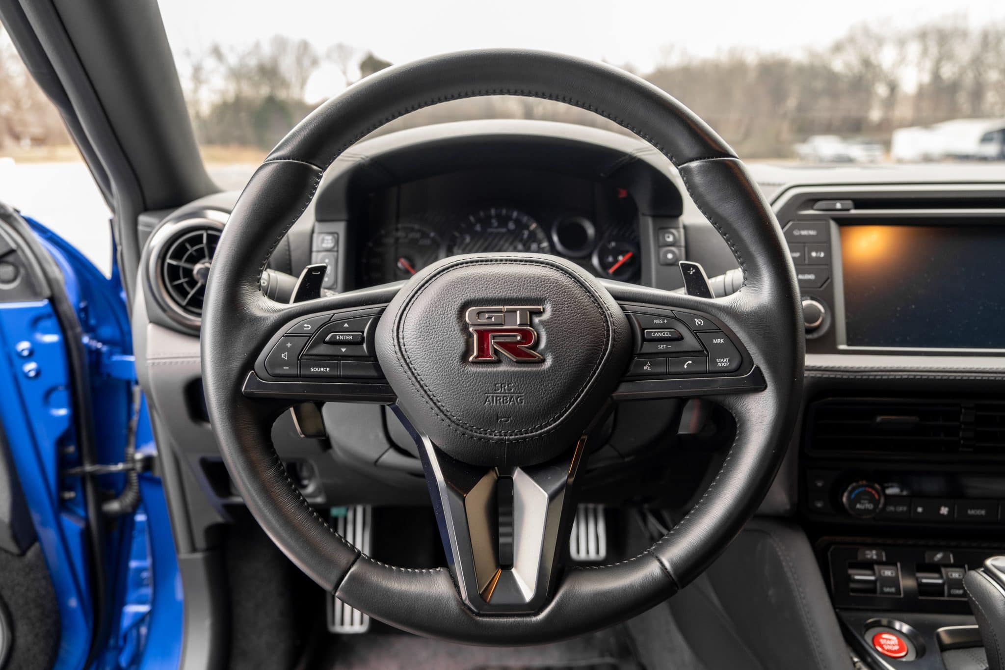 Steering wheel, instrument binnacle and centre screen of a Nissan GT-R