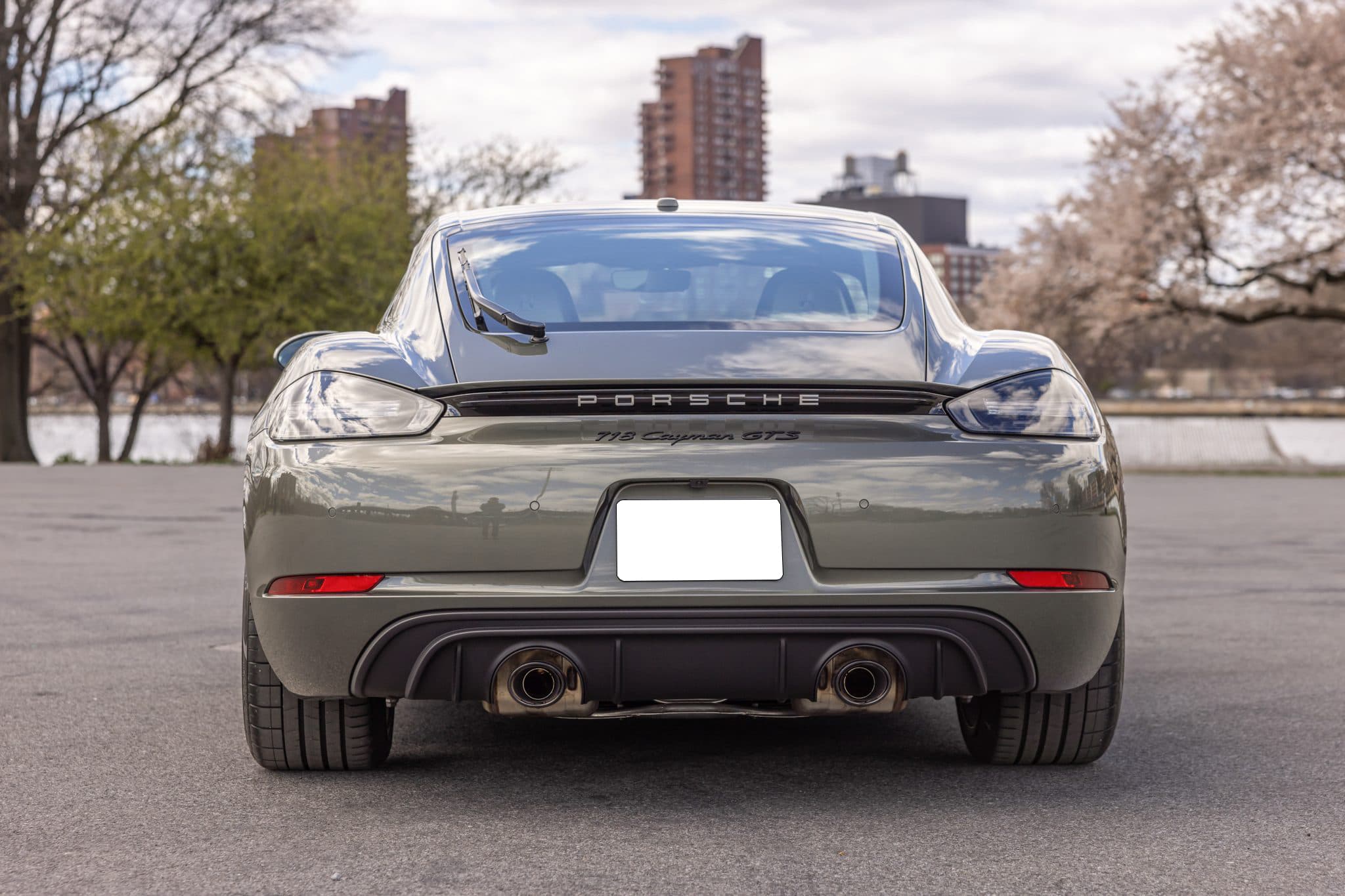 Rear of a Porsche 718 Cayman GTS 4.0, showing the badging, diffuser and twin centre exhausts